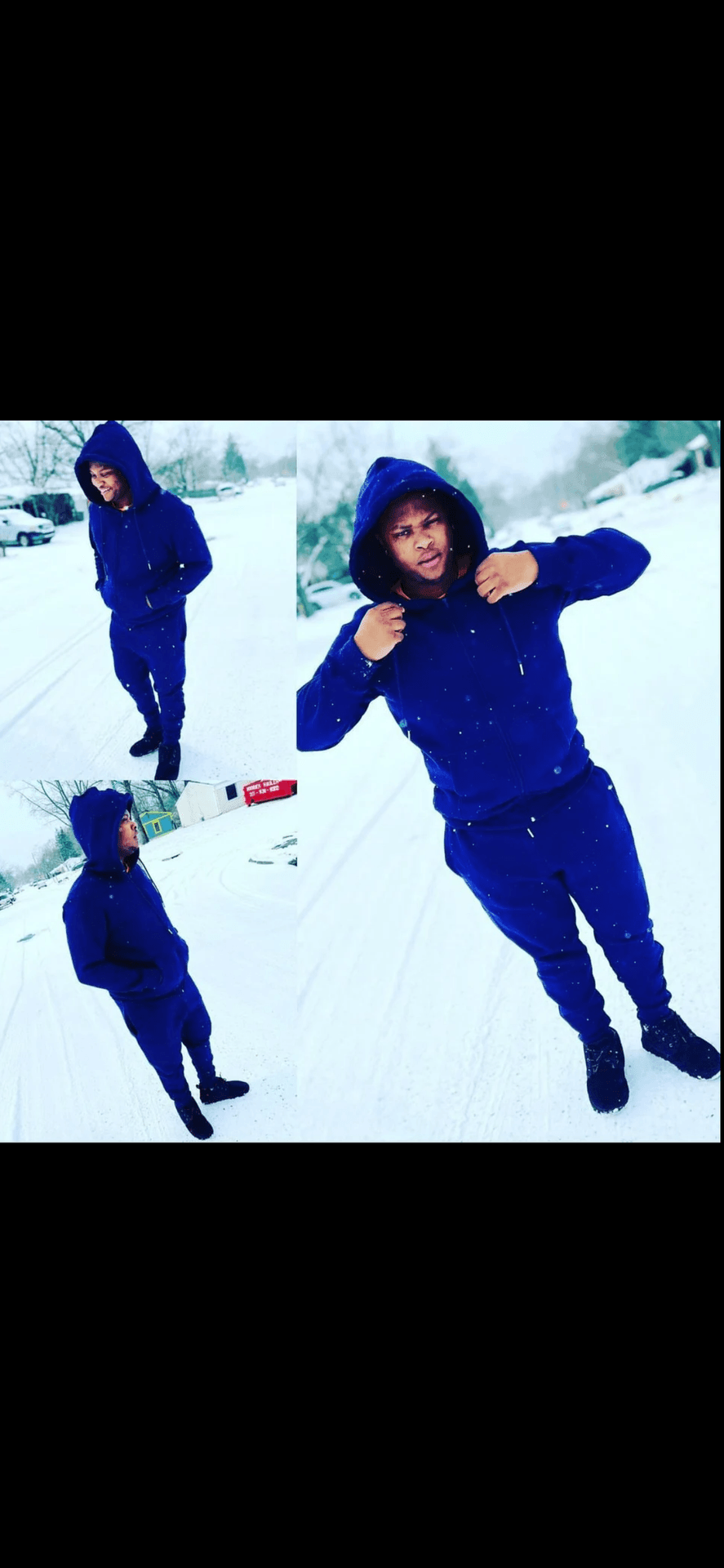 Individual wearing a blue hoodie and sweatpants standing on a snowy street.